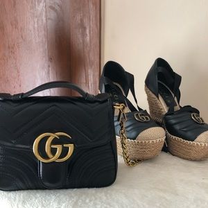 Black leather bag with gold hardware